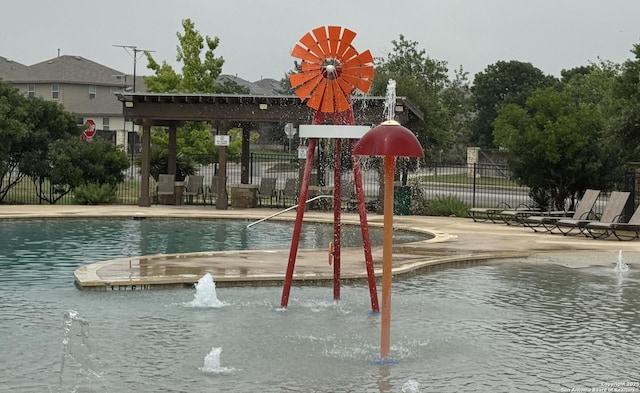 268 Cuban Emerald, San Antonio, TX 78253 - view of play area with a patio, fence, and a community pool