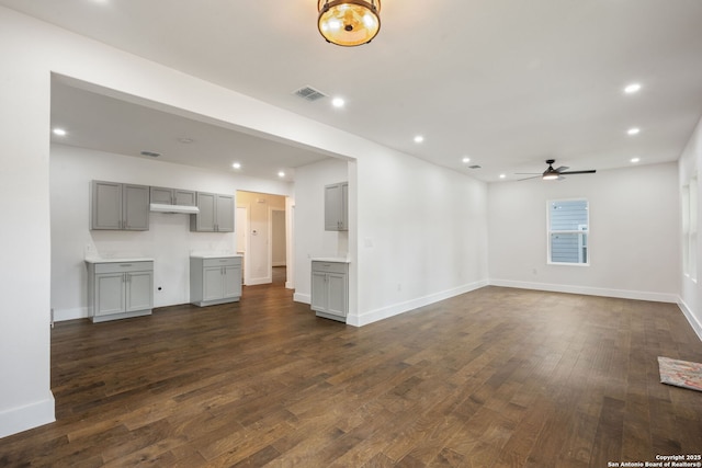 1030 Elsmere, San Antonio, TX 78201 - unfurnished living room with recessed lighting, a ceiling fan, visible vents, and dark wood finished floors