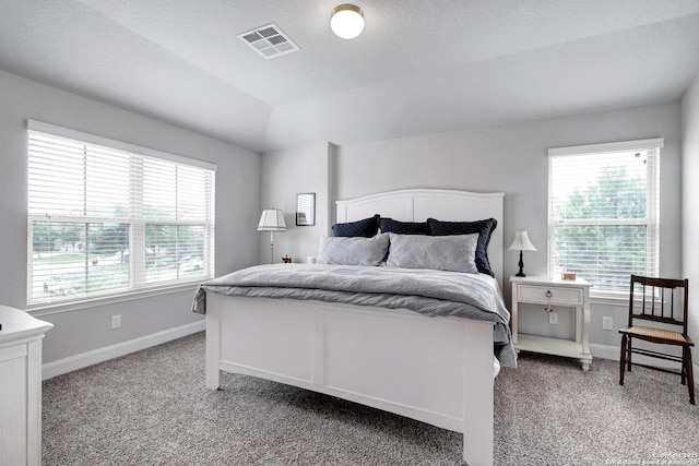 bedroom with light colored carpet, visible vents, and baseboards