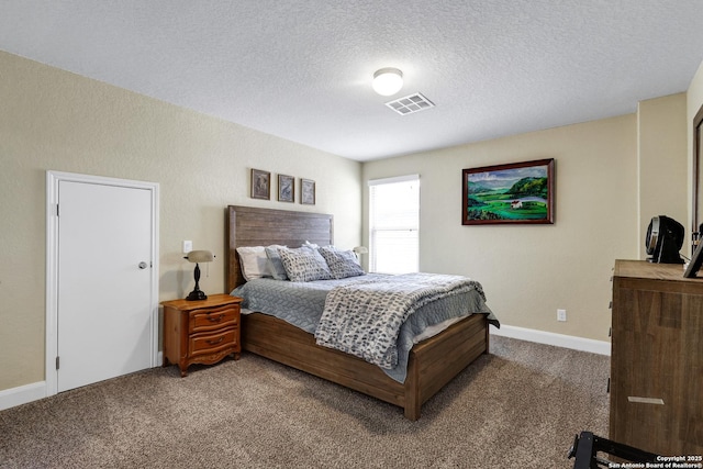 bedroom featuring carpet, a textured ceiling, visible vents, and baseboards