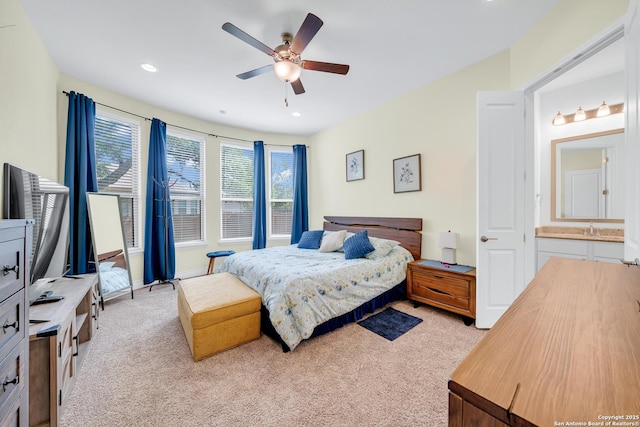 bedroom with a ceiling fan, recessed lighting, and light colored carpet