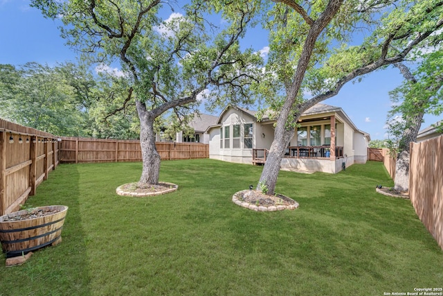 view of yard with a fenced backyard