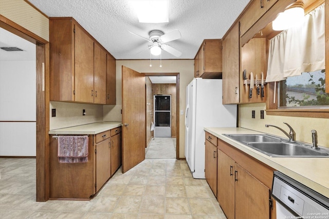 616 Ridgecrest, New Braunfels, TX 78130 - kitchen featuring a sink, white appliances, light countertops, and visible vents