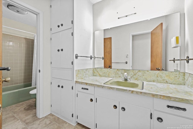 616 Ridgecrest, New Braunfels, TX 78130 - full bath featuring vanity, shower / bath combo with shower curtain, and tile patterned flooring