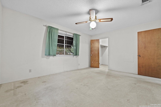 616 Ridgecrest, New Braunfels, TX 78130 - unfurnished bedroom with a textured ceiling, a ceiling fan, and visible vents