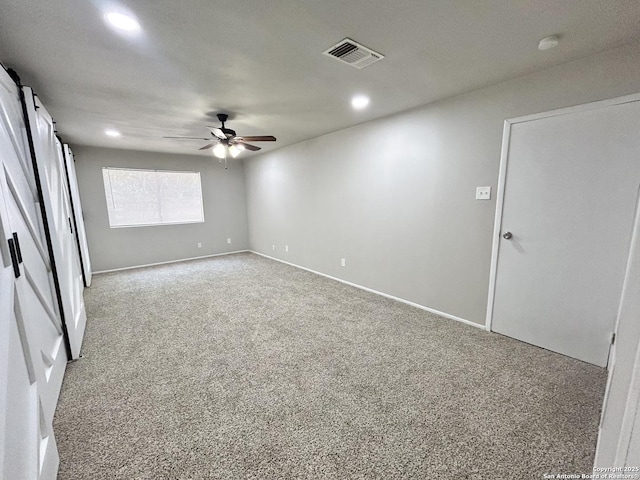 carpeted empty room with a ceiling fan, recessed lighting, baseboards, and visible vents