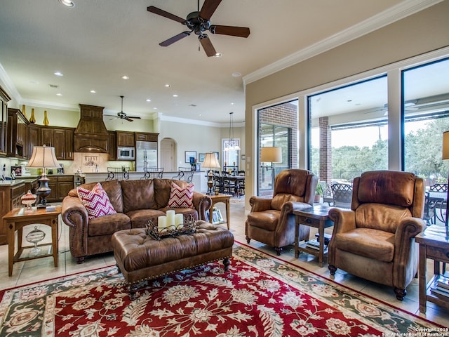 living room featuring crown molding, light tile patterned floors, a ceiling fan, and recessed lighting