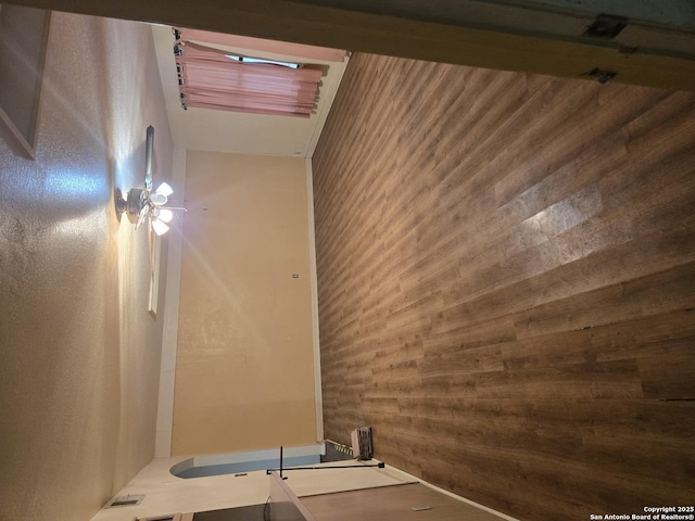 empty room featuring wooden walls
