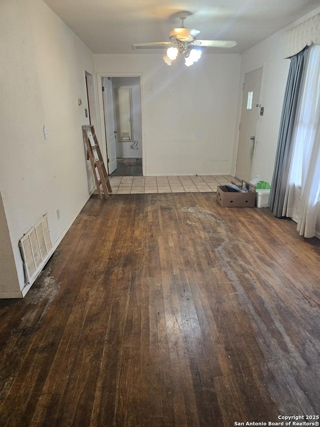 spare room featuring hardwood / wood-style flooring and a ceiling fan