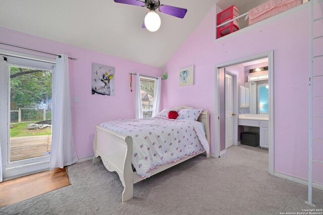 bedroom with access to outside, a ceiling fan, carpet floors, ensuite bathroom, and vaulted ceiling