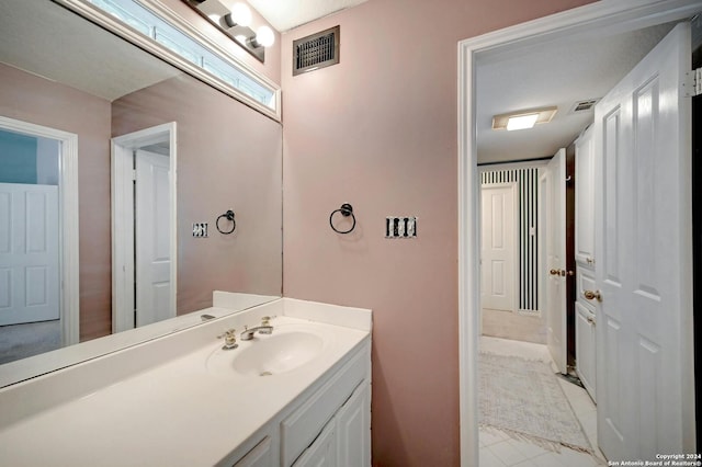 bathroom featuring visible vents and vanity
