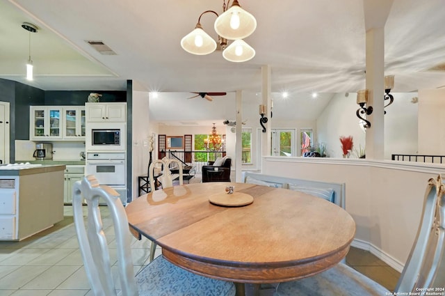 dining area with a ceiling fan, light tile patterned floors, and visible vents