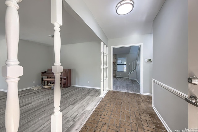 hall featuring baseboards