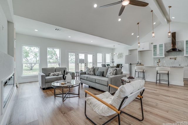 109 Hidden Hls, Floresville, TX 78114 - living area with recessed lighting, light wood-type flooring, ceiling fan, and vaulted ceiling with beams