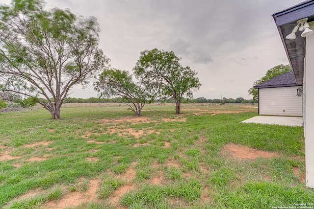 109 Hidden Hls, Floresville, TX 78114 - view of yard featuring a rural view and a patio area
