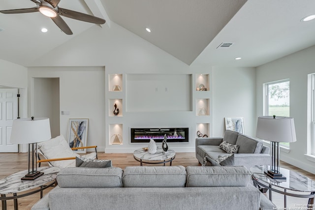 109 Hidden Hls, Floresville, TX 78114 - living room featuring visible vents, recessed lighting, light wood finished floors, ceiling fan, and a glass covered fireplace