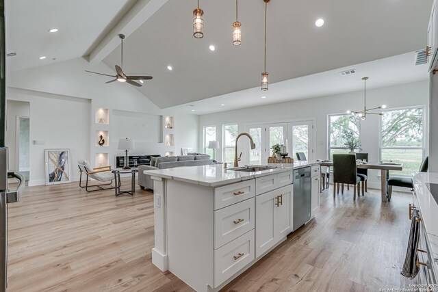 109 Hidden Hls, Floresville, TX 78114 - kitchen with high vaulted ceiling, a sink, stainless steel dishwasher, visible vents, and beamed ceiling