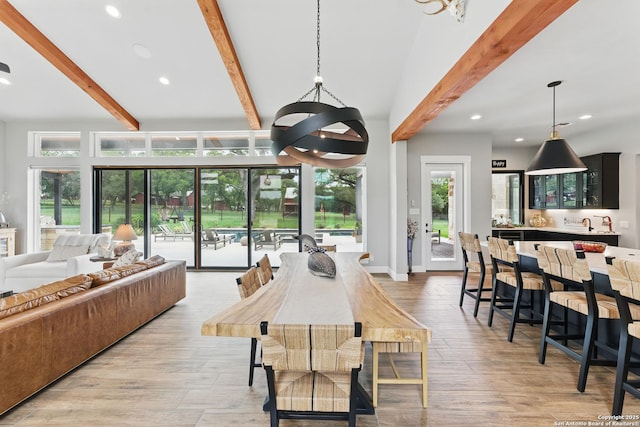 821 Bingham Ln, New Braunfels, TX 78132 - dining room with light wood-style floors, an inviting chandelier, recessed lighting, and beam ceiling