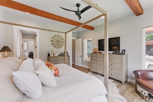 821 Bingham Ln, New Braunfels, TX 78132 - bedroom featuring ensuite bath, beam ceiling, baseboards, and light wood-style floors