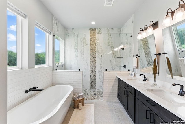 821 Bingham Ln, New Braunfels, TX 78132 - bathroom with a sink, a soaking tub, walk in shower, and visible vents