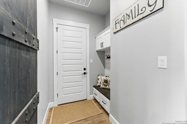 821 Bingham Ln, New Braunfels, TX 78132 - mudroom featuring baseboards, light wood finished floors, and visible vents