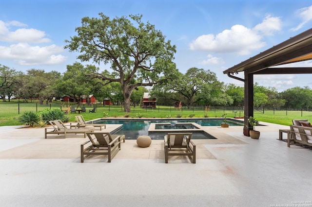 821 Bingham Ln, New Braunfels, TX 78132 - view of swimming pool featuring a lawn, a pool with connected hot tub, a patio, and fence