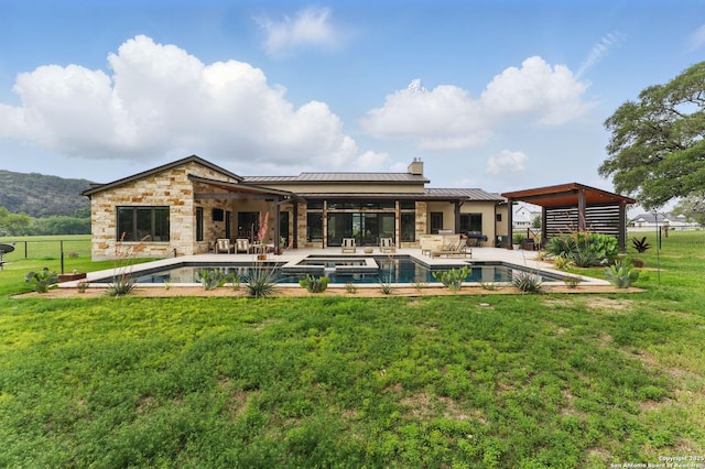 821 Bingham Ln, New Braunfels, TX 78132 - rear view of property with a lawn, a patio area, a standing seam roof, and an outdoor pool