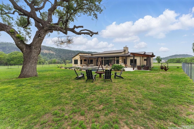 821 Bingham Ln, New Braunfels, TX 78132 - view of yard with a mountain view, a patio, and fence