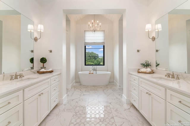 full bath with a sink, baseboards, and marble finish floor