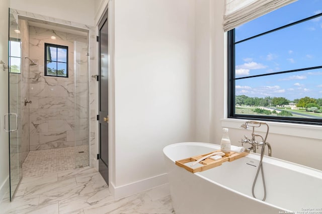 full bathroom with a freestanding bath, a marble finish shower, baseboards, and marble finish floor