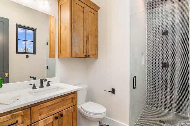 full bath featuring vanity, toilet, and a shower stall