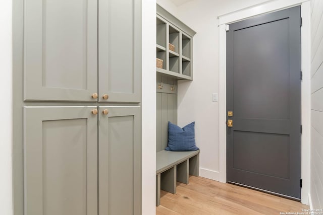 mudroom with baseboards and light wood-style floors
