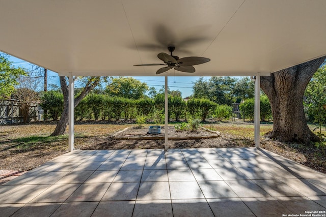 view of patio / terrace featuring fence and a ceiling fan