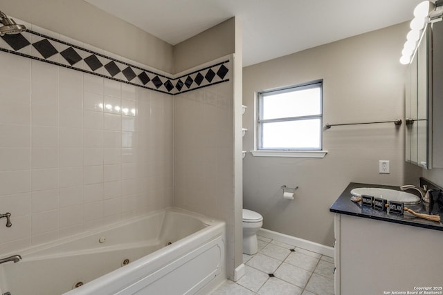 bathroom featuring a combined bath / shower with jetted tub, toilet, baseboards, tile patterned flooring, and vanity