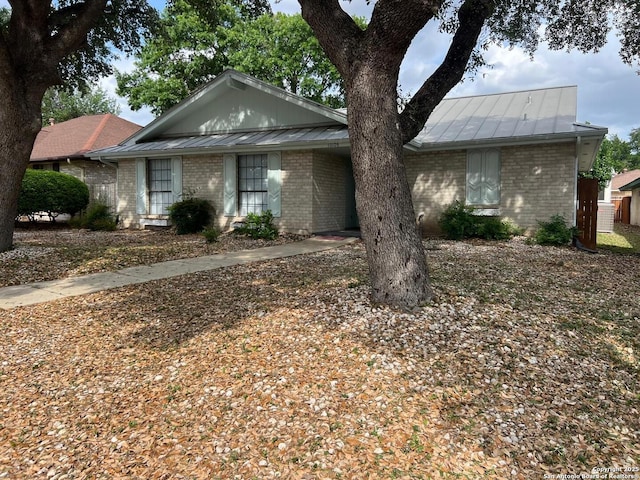 10106 Grand Park, San Antonio, TX 78239 - single story home featuring brick siding, metal roof, and a standing seam roof