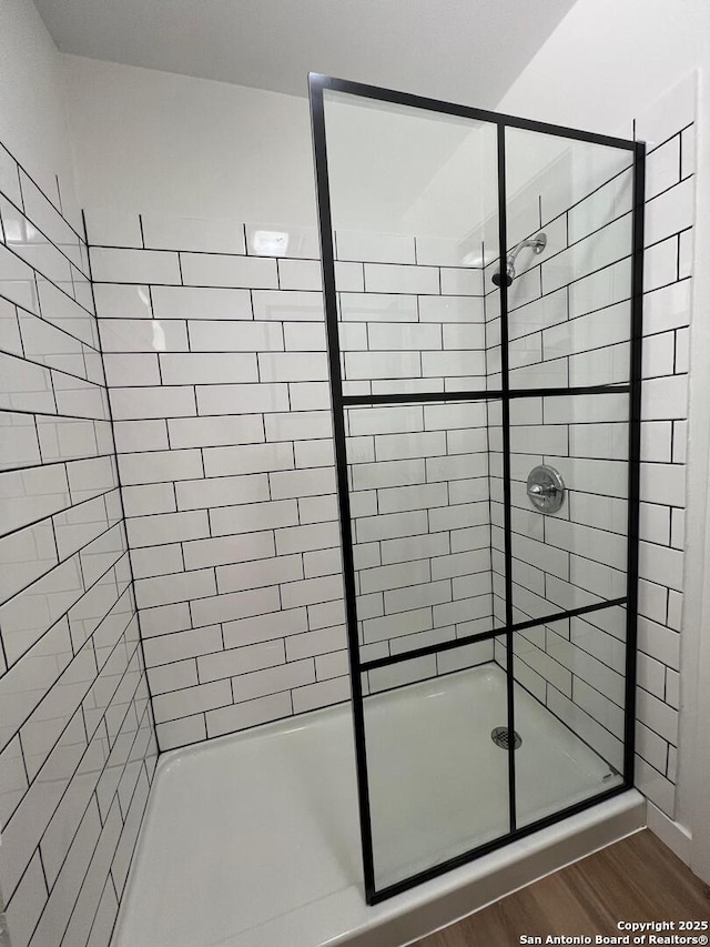 10106 Grand Park, San Antonio, TX 78239 - bathroom featuring a stall shower and wood finished floors