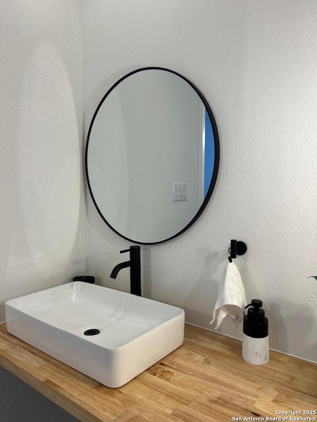 10106 Grand Park, San Antonio, TX 78239 - bathroom featuring wood finished floors and a sink