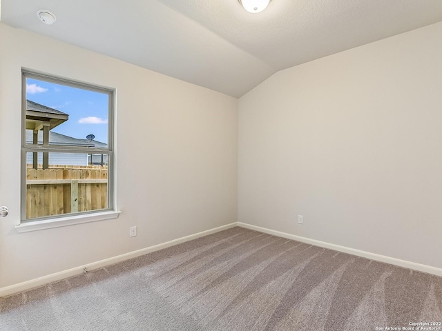 4532 Appaloosa Crst, San Antonio, TX 78245 - spare room with carpet flooring, vaulted ceiling, and baseboards
