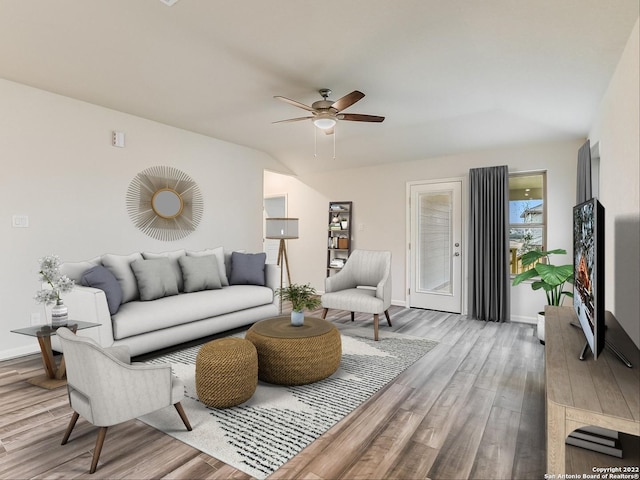 4532 Appaloosa Crst, San Antonio, TX 78245 - living area featuring ceiling fan, baseboards, and wood finished floors