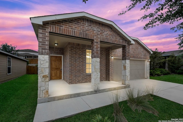 7631 Paraiso Pt, Boerne, TX 78015 - view of front of property with brick siding, an attached garage, and driveway