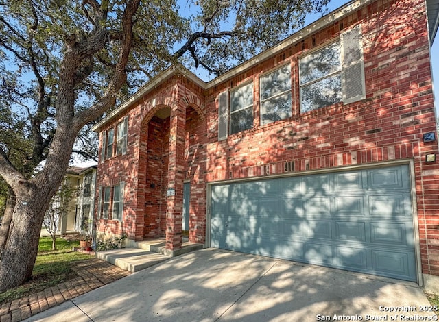 15814 Marisa, San Antonio, TX 78247 - traditional-style house with brick siding, driveway, and a garage