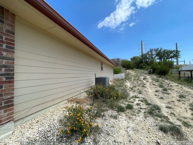 458 Vicksburg, Kerrville, TX 78028 - view of home's exterior featuring central air condition unit