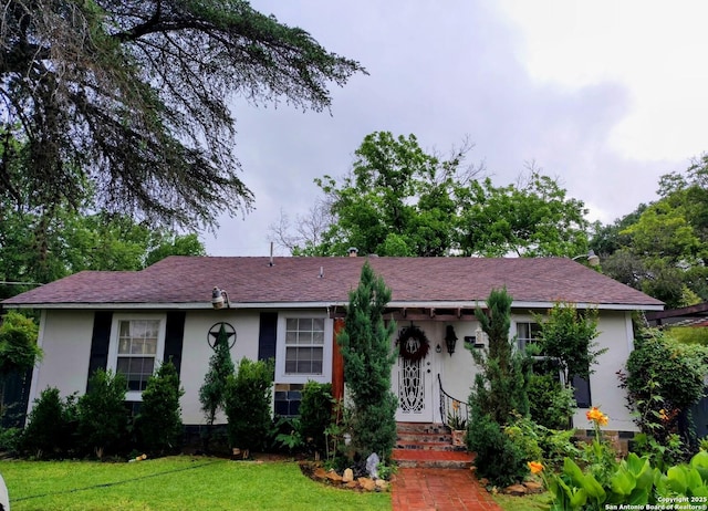 724 Holmgreen, San Antonio, TX 78220 - view of front of home with a front lawn and stucco siding