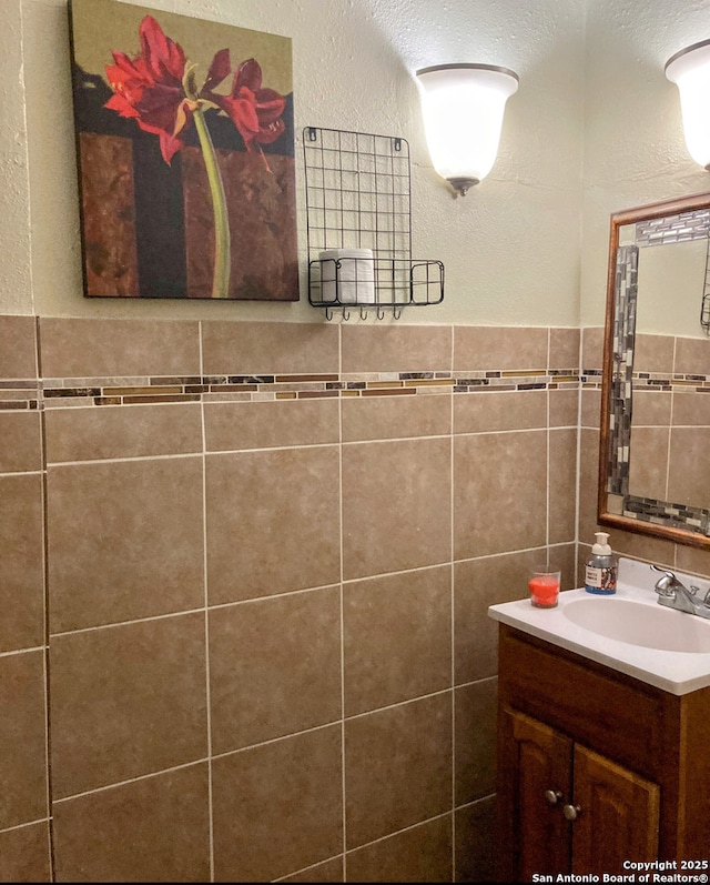 724 Holmgreen, San Antonio, TX 78220 - bathroom with vanity and tile walls
