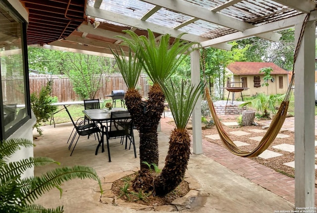 724 Holmgreen, San Antonio, TX 78220 - view of patio / terrace featuring outdoor dining space, a pergola, and fence