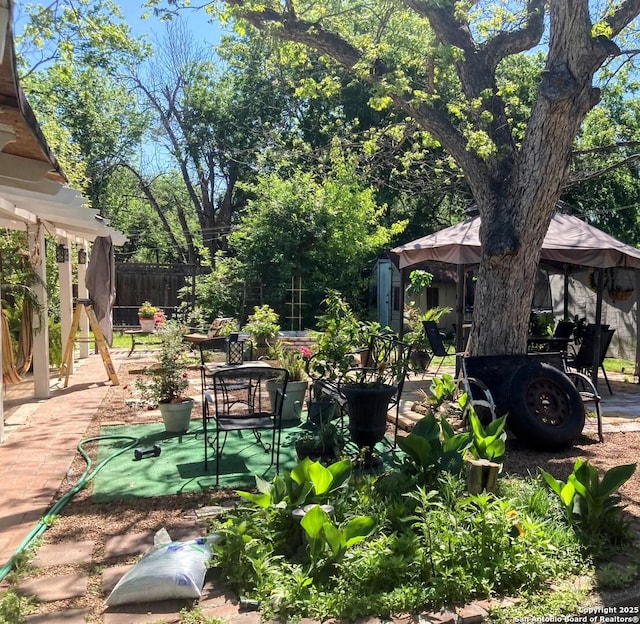 724 Holmgreen, San Antonio, TX 78220 - view of yard featuring a shed, fence, a patio area, and an outdoor structure