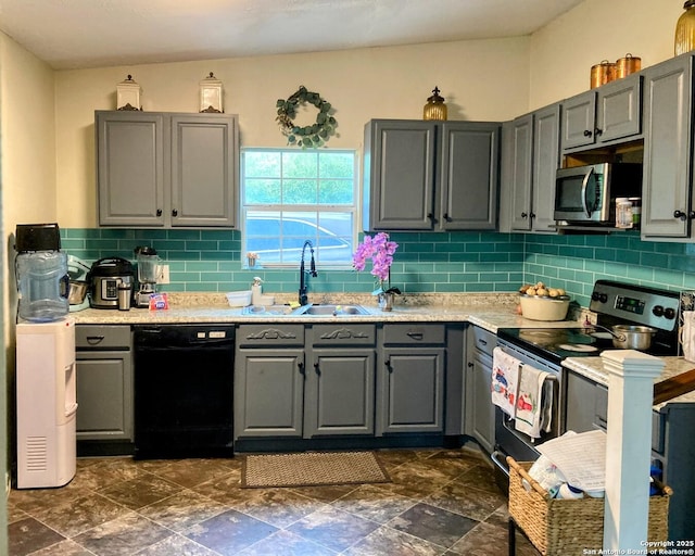 724 Holmgreen, San Antonio, TX 78220 - kitchen with a sink, stainless steel appliances, decorative backsplash, and gray cabinets