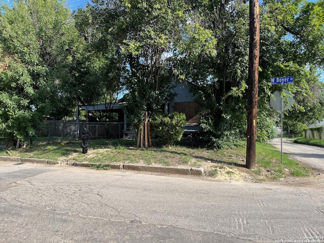 obstructed view of property with fence