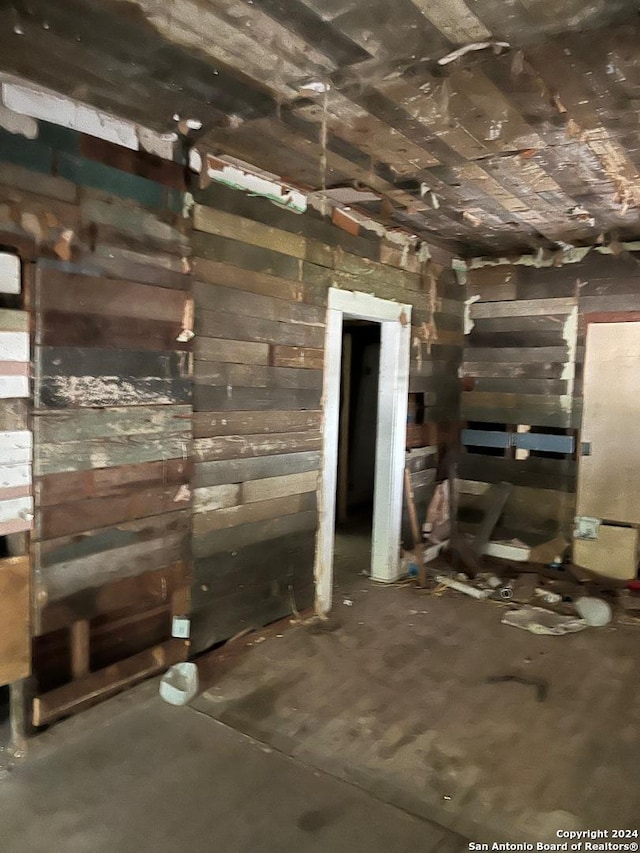interior space featuring unfinished concrete flooring