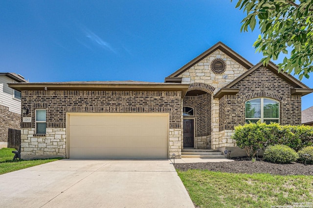 2253 Sun Stone, New Braunfels, TX 78130 - view of front of property featuring brick siding, an attached garage, stone siding, and concrete driveway